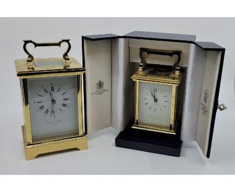 A large Mappin & Webb brass carriage clock, having signed white enamel dial with Roman numeral chapter ring and Arabic numera