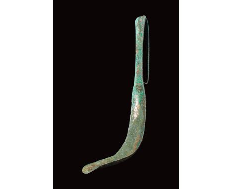 Ca. 400 - 300 BC .A bronze strigil, a cleaning tool traditionally used in ancient baths and athletic training. This implement
