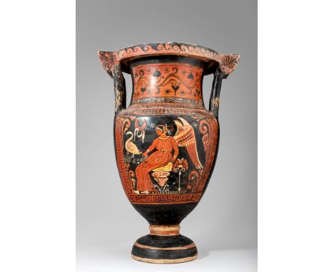 Ca. 350 BC.A red-figure column krater in an ornate style features handles adorned with painted palmettes. The intricate scene