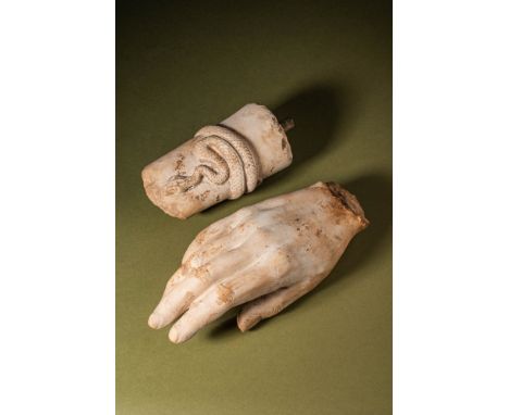 Ca. AD 50 - 200 .An arm of a marble statue composed of two parts. The larger section is a hand crafted in an exceptionally na