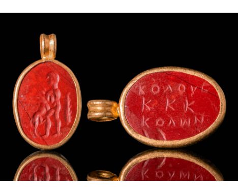 Ca. AD 100 - 300.A gold pendant with carnelian intaglio that illustrates a classic theme from mythology: Hercules strangling 