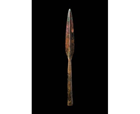 Ca. AD 100 - 300.A double-edged spearhead with a leaf-shaped blade, tapering to a point. A longitudinal mid-rib reinforces th
