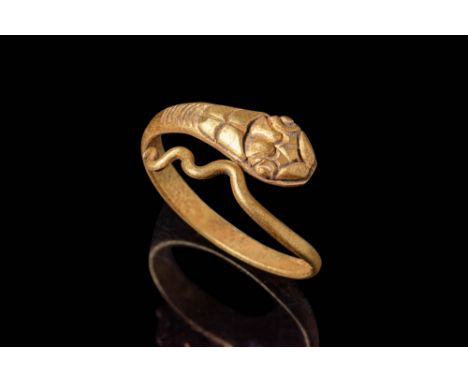 Ca. 30 BC - AD 200.A gold 21.8 ct snake ring with a naturalistic head and engraved scales on the body and on the head, the ta