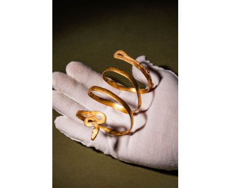 Ptolemaic Period, Ca. 332 - 30 BC.A gold 21 ct bracelet shaped like a snake features five coils, with the head and tail craft
