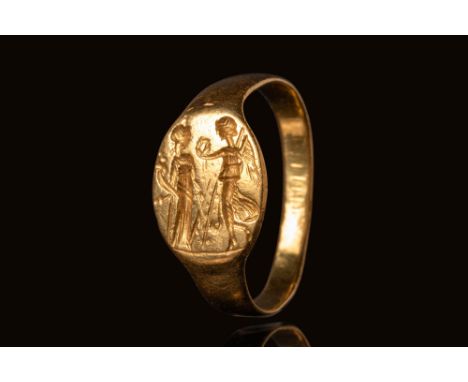 Ca. 400 - 300 BC.A gold ring with a smooth, plain flat-section hoop that widens to form an oval-shaped bezel. The bezel holds