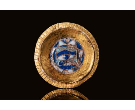 Ca. 100 BC - AD 100.A circular gold plaque with a recessed central field bordered by a flat rim, incised with fine hatching a