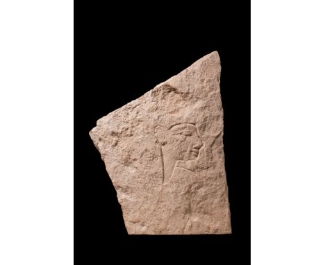 New Kingdom, 18th Dynasty, Ca. 1353 - 1336 BC.A relief, carved from pale orange sandstone, depicting a tall figure, probably 