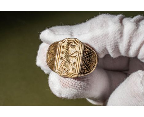 Ca. AD 1200 - 1400.A possibly British silver gilt ring with a D-section hoop enlarged on the decorated shoulders with incised