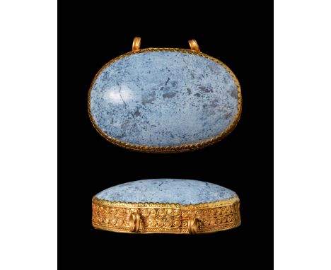 Ca. 300 - 200 BC.A pendant features a high gold frame elegantly adorned with a stylised vegetal pattern along its walls. It h