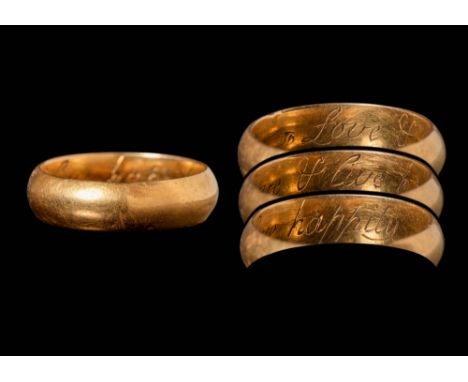 Ca. AD 1700.A gold ring with a plain band and a slightly rounded outer profile. The gold has a warm, light yellowish-brown to