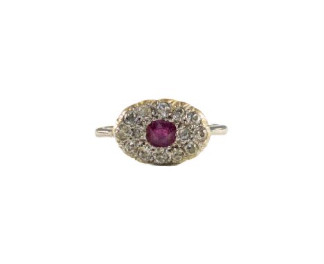 European circa 1920 A small ruby and pave-set diamond cluster ring Mounted in white gold&nbsp; Weight: Approx: 4gm&nbsp; Dime