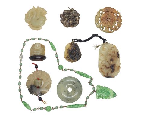Chinese 20th Century A group of jade and jadeite pendants Comprising of nine pendants, including a nephrite lily pad and carp