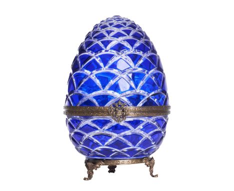 French 20th Century A Faberge caviar and vodka set The cobalt egg-form hinged case with embossed brass banding and Russian Im