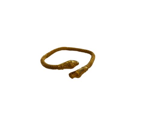Middle Eastern circa 1890A heavy high carat yellow gold snake Torq bangleTotal weight:Approx 105 grams.