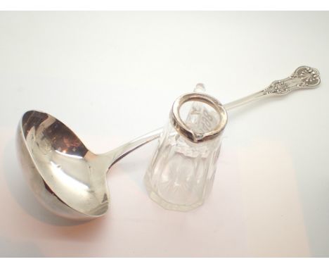 Small glass cream jug with silver collar WHS London and a silver plated soup ladle 