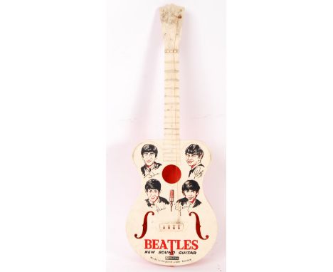 A rare vintage 1960's Selcol made The Beatles ' New Sound Guitar '. The face decorated with caricatures of all four Beatles, 