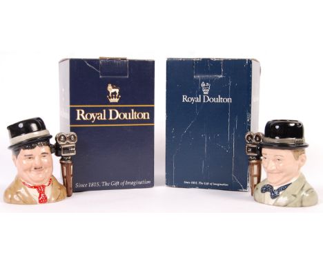 A pair of vintage Royal Doulton made ceramic ' Laurel &amp; Hardy ' character jugs D7009 and D7008. Limited edition, both No.