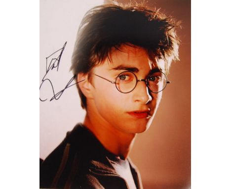 Daniel Radcliffe - British Actor - autographed 8x10" colour photograph of him as Harry Potter. Signed in black marker by Radc