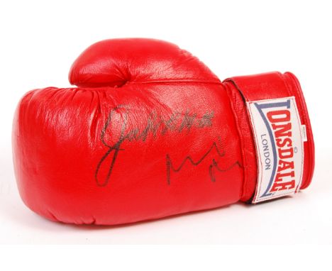 An incredibly rare Raging Bull dual-signed / autographed boxing glove by boxer Jake LaMotta and Robert De Niro. The Lonsdale 