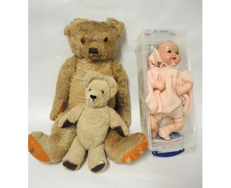 Large Merrythought teddy bear with jointed limbs, together with another smaller teddy bear and an Armand Marseille compositio