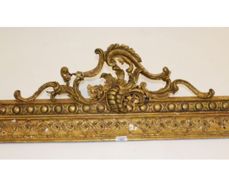 19th Century gilded composition pelmet, 132cm wide (at fault), together with a quantity of other giltwood fragments including