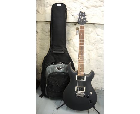 Cort electric six string guitar with Fender guitar stand, lead and other accessories in a padded travel case