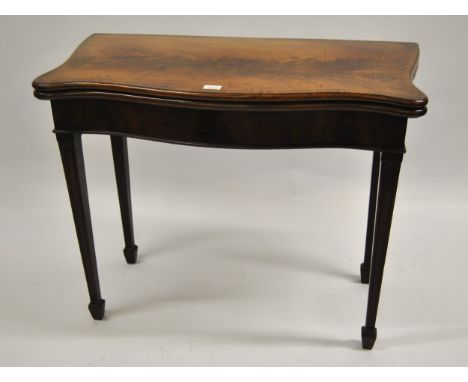 George III mahogany and crossbanded serpentine fronted concertina action fold-over card table on square tapering supports, 92