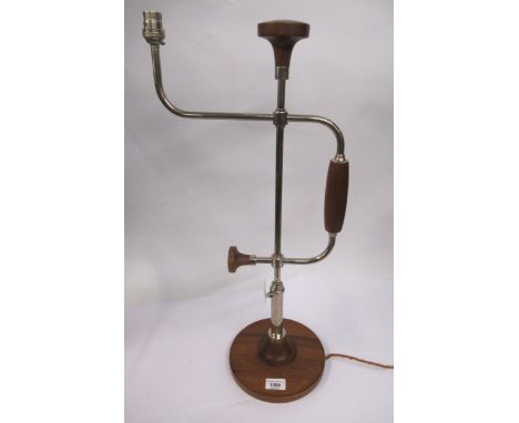 David Linley, silver plated and walnut table lamp in the form of a woodworking brace, signed in the metal, 65cm high