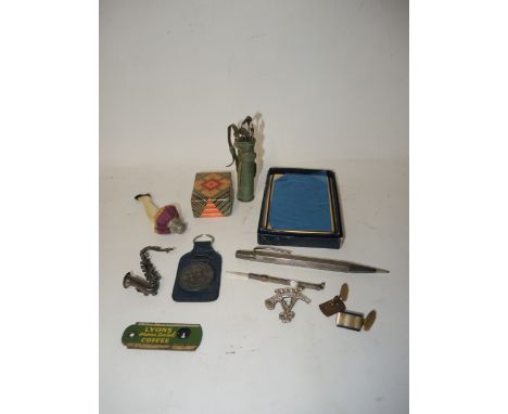 Unusual leather and sterling silver manicure set in the form of a bag of golf clubs, silver brooch in the form of a saxophone