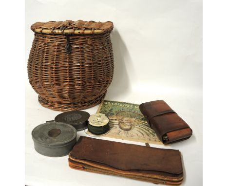 Pot bellied creel basket, together with a leather fishing tackle wallet, with tools, another empty wallet and one volume, ' M