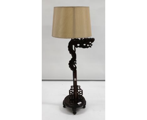 Chinese hardwood table lamp in the form of a dragon, 94cm high
