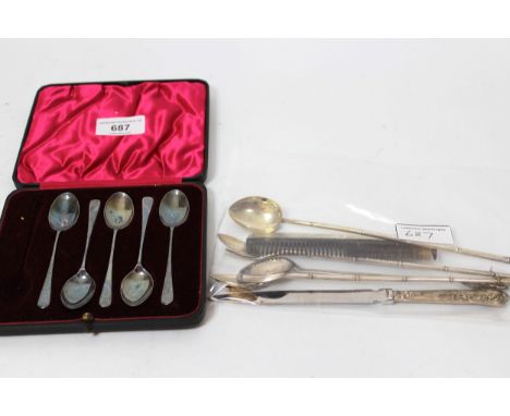 Three silver straws, five silver teaspoons, two Chinese silver spoons, silver handled paper knife and a silver mounted comb