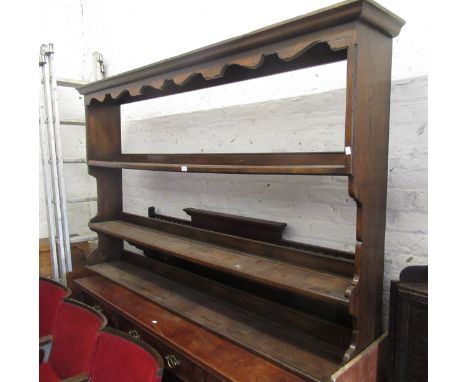 Oak dresser rack, the moulded cornice above three open shelves, 196cm wide