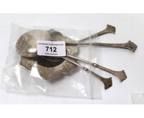 Russian silver tea strainer, two spoons and a fork