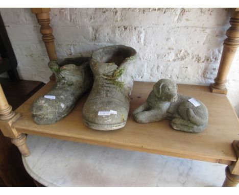 Group of five concrete garden ornaments including two figures, two boots and a dog