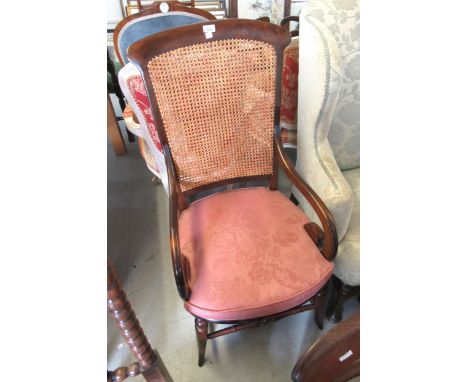 19th Century mahogany open elbow chair with cane back and seat, together with a mahogany open elbow chair with a circular pie