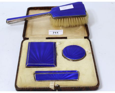 Birmingham silver blue enamel decorated cigarette case, compact and comb in a fitted case, together with a similar hairbrush 