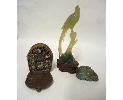 Tibetan Buddhist ghau (travel shrine), together with a soapstone figure of a bird and a carved hardstone figureLosses to soap