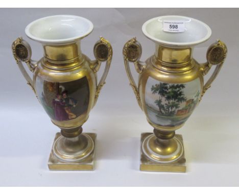 Pair of 19th Century Paris porcelain two handled pedestal vases, painted with panels of figures and landscapes on a gilt and 