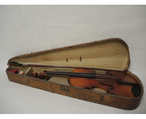 Late 19th Century German violin with 14.25in two piece back, in a walnut case with bow, the bow stamped KGP (various damages)