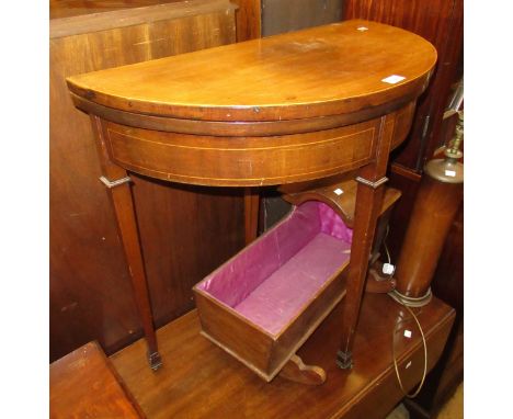 Edwardian mahogany demi lune card table in Georgian style raised on square tapering supports, 75cm wide