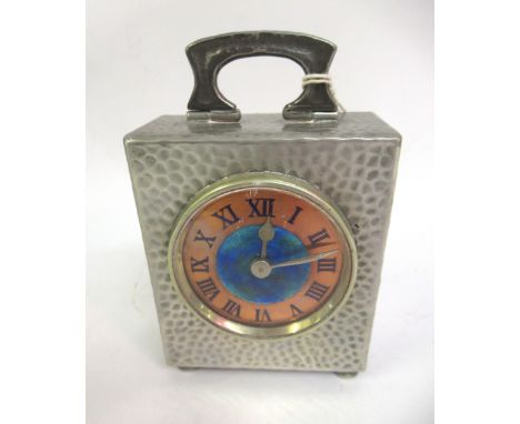 Tudric pewter cased mantel timepiece, the enamel and copper dial with Roman numerals and single train fixed keywind movement,