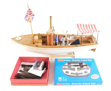 A plastic and balsa wood scale model of The African Queen, on stand, 69cm L, together with two boxes of N gauge railway track