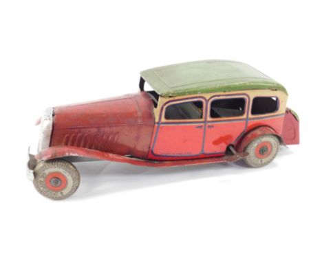 An English tin plate clockwork model of a Citroen Rosalie, circa 1934, with Dunlop 90 tyres, 28cm L.