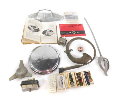 A vintage car horn, a hub cap, Morris Minor manual 1954, petrol cap, Smiths car clock, and sundries. (qty)