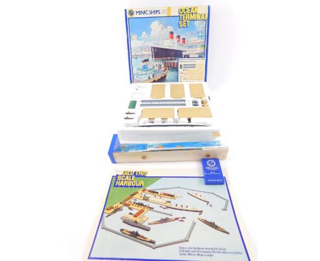 A Hornby Minic Ships die-cast model of an ocean terminal set, including the RMS Queen Mary, scale 1:1200,. together with a mo