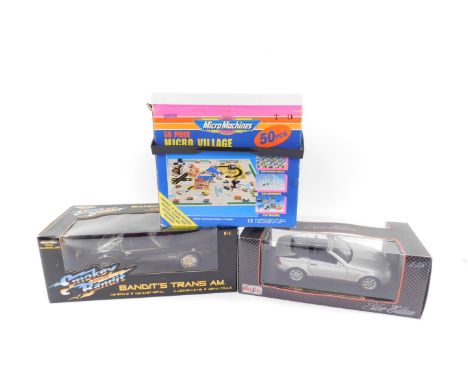 A Maisto Silver Edition model of a Mercedes Benz SLK 2030 1996, scale 1:18, boxed, together with an American Muscle Smokey an