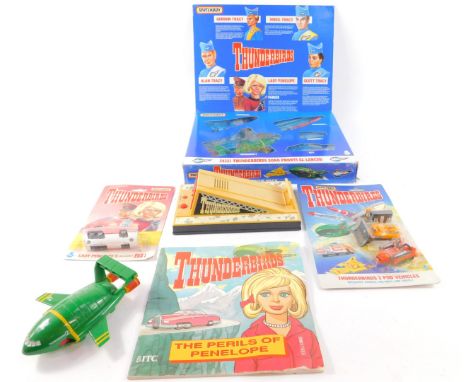 A Matchbox Thunderbirds rescue pack, TB-700, boxed, a Lady Penelope's Rolls Royce Fab 1, two pod vehicles, Thunderbird 2, tog
