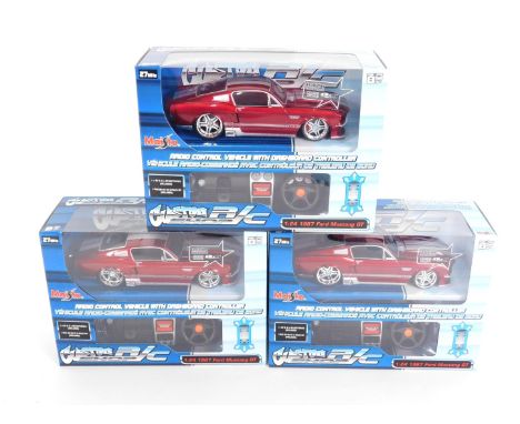 Three Maisto radio controlled vehicles, with dashboard controller, boxed, scale 1:24, comprising three 1967 Ford Mustang GT.