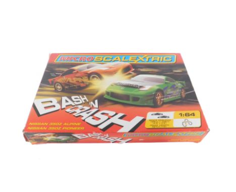 A Micro Scalectrix, scale 1:64 containing a Nissan 350Z Alpine and a Nissan 350Z Pioneer, boxed